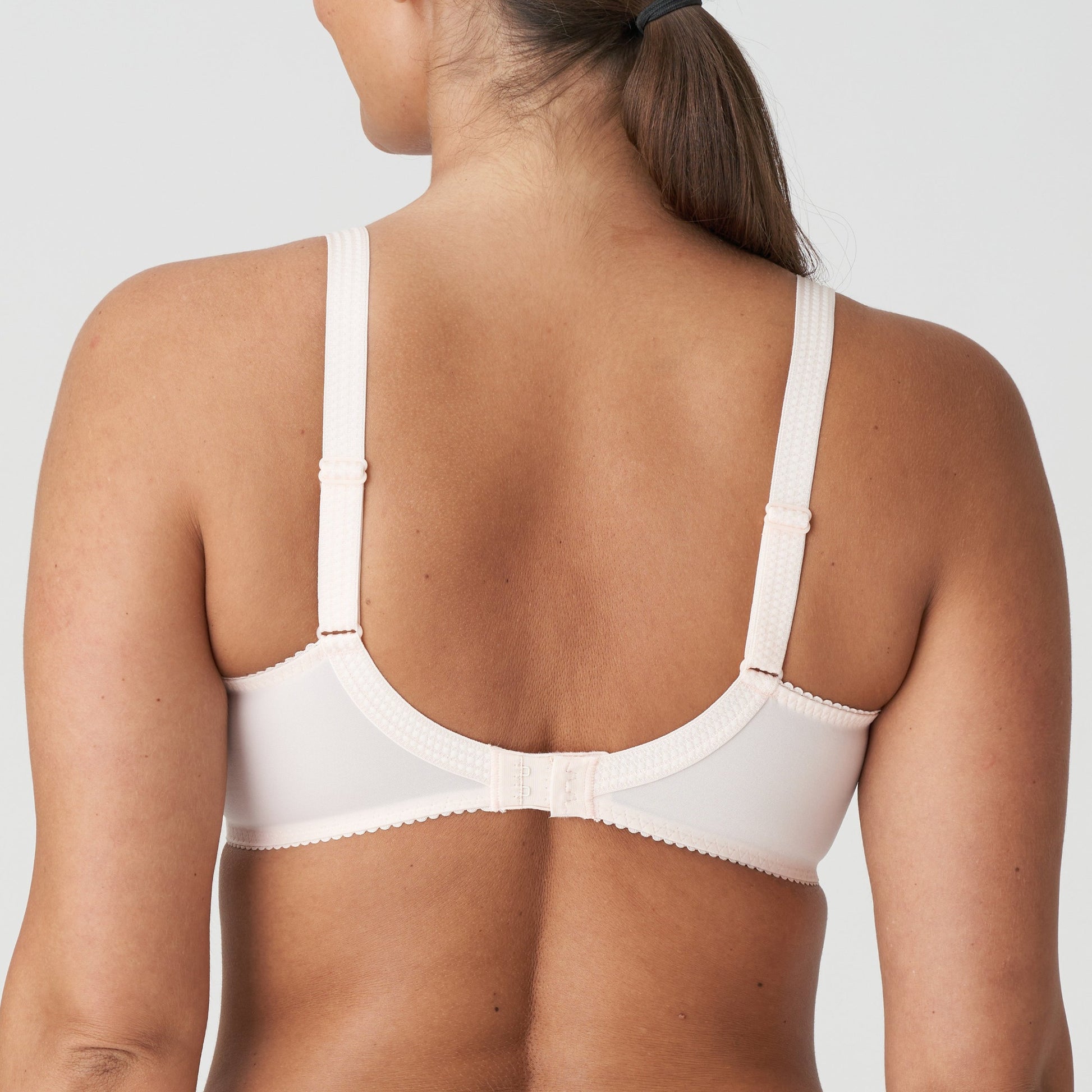 Back view of a woman wearing the DD+ Montara Full Cup Bra in Crystal Pink by Primadonna.