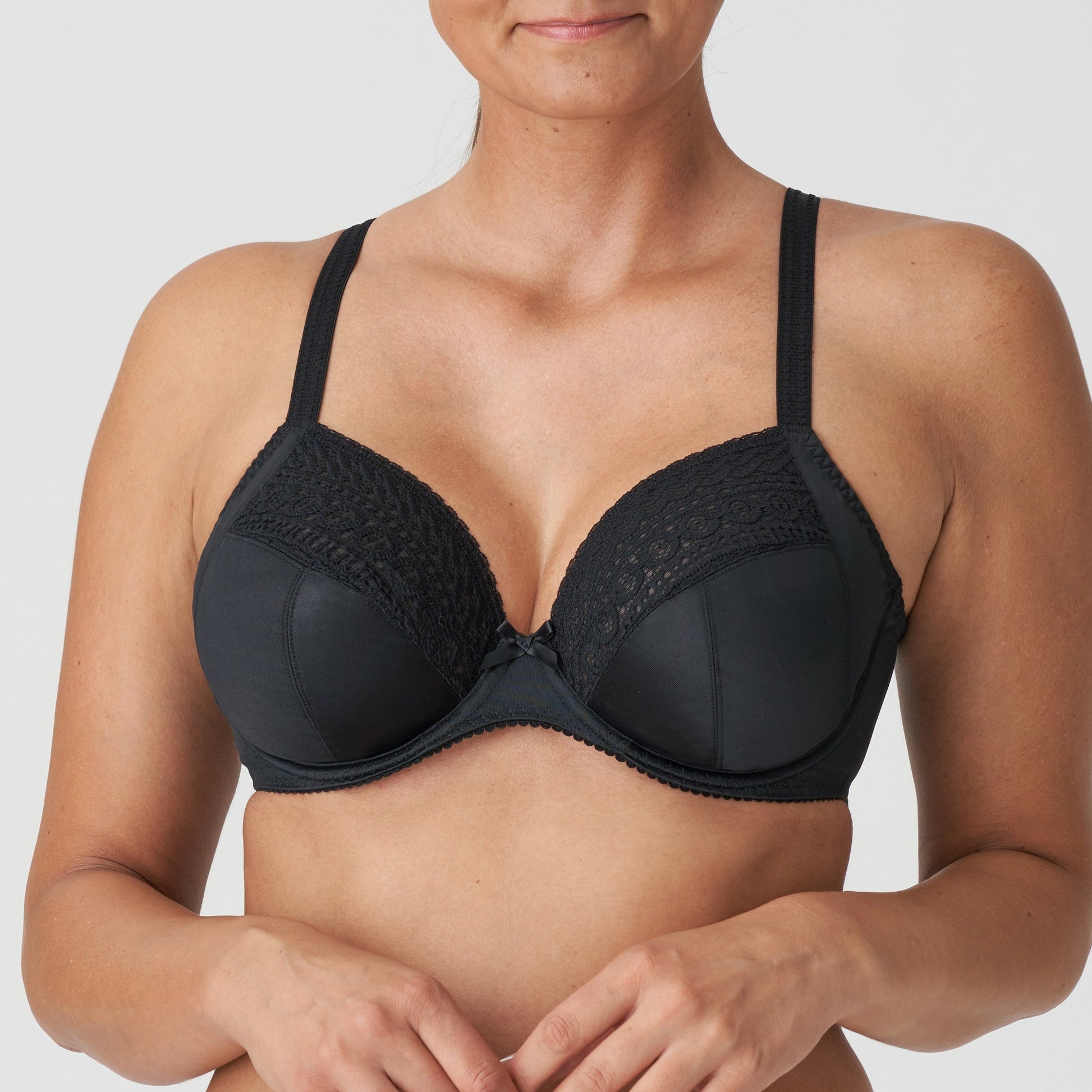 Front view of a woman wearing the Montara fuller bust plunge bra in Black by Primadonna.
