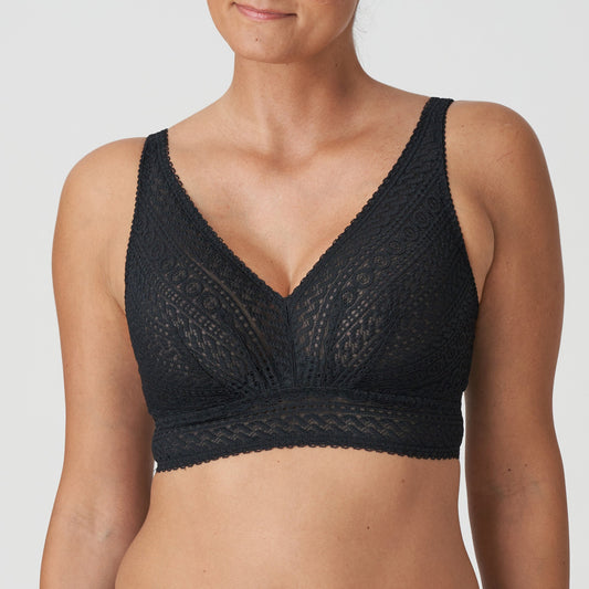 Front view of a woman wearing the Montara DD+ wireless longline full support bralette in black lace by PrimaDonna.