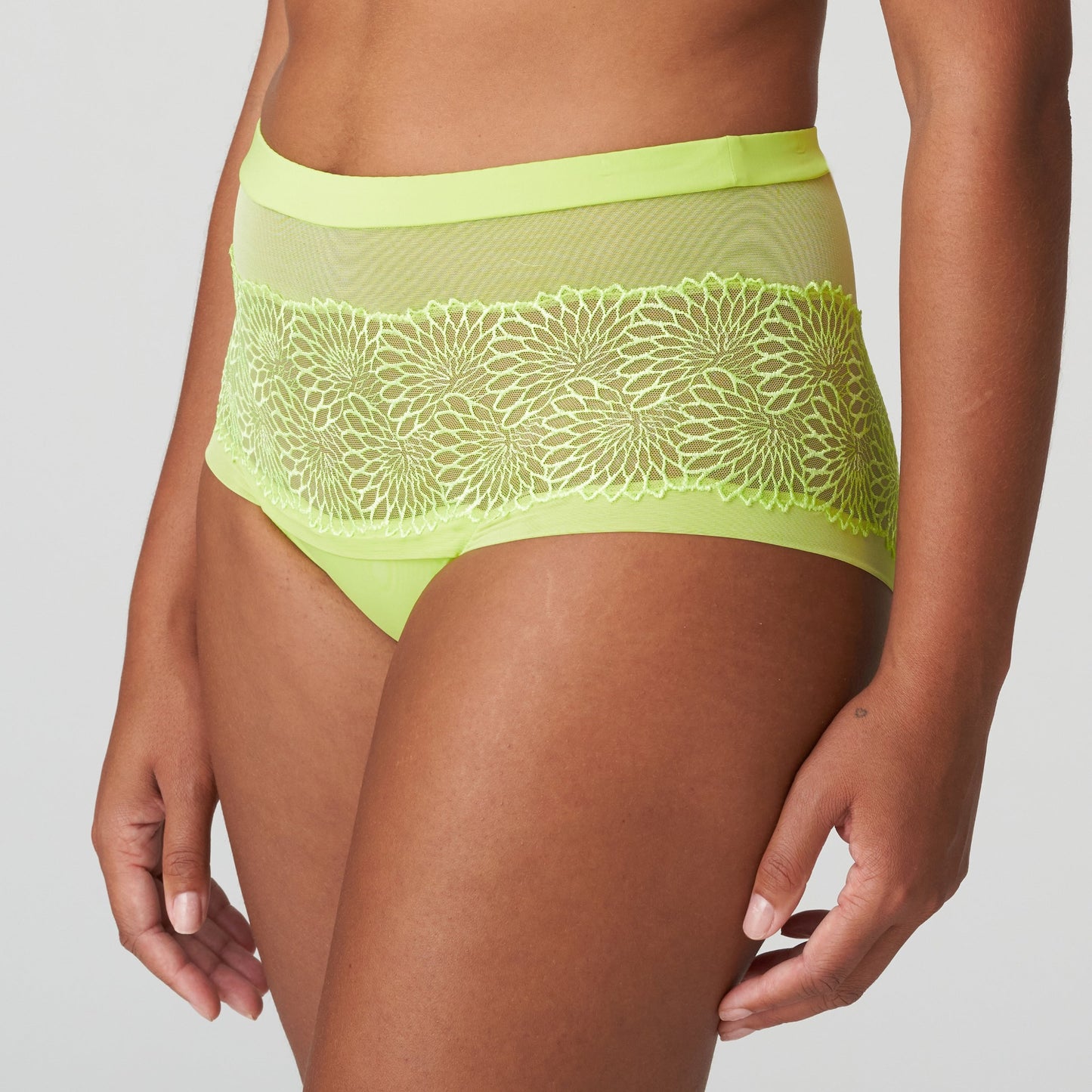 Side view of a woman wearing the Sophora high-waisted cheeky panty in Lime Crush by PrimaDonna.