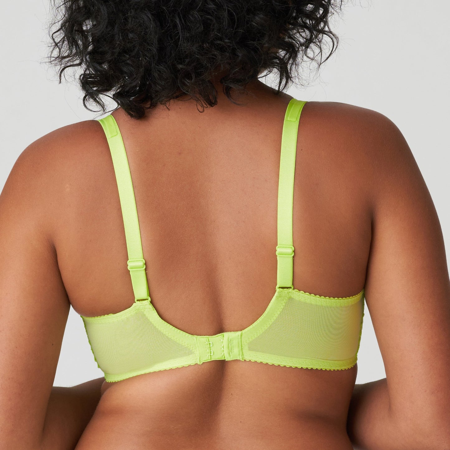 Back view of a woman wearing the DD+ Sophora Full Cup Bra in Lime Crush by PrimaDonna.