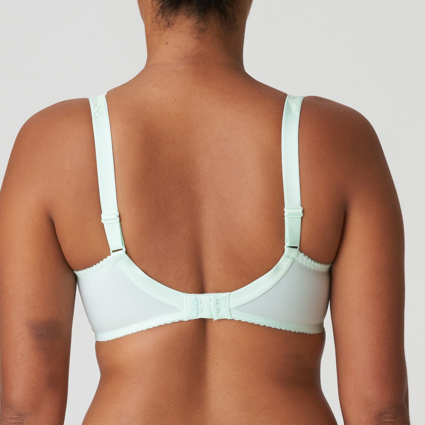 Back view of a woman wearing the Madison Unpadded Seamless T-Shirt Bra in Duck Egg by PrimaDonna.