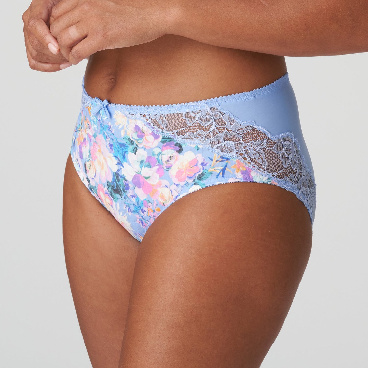 Side view of a woman wearing the Madison Full Brief panty with lace in Periwinkle Floral by PrimaDonna.