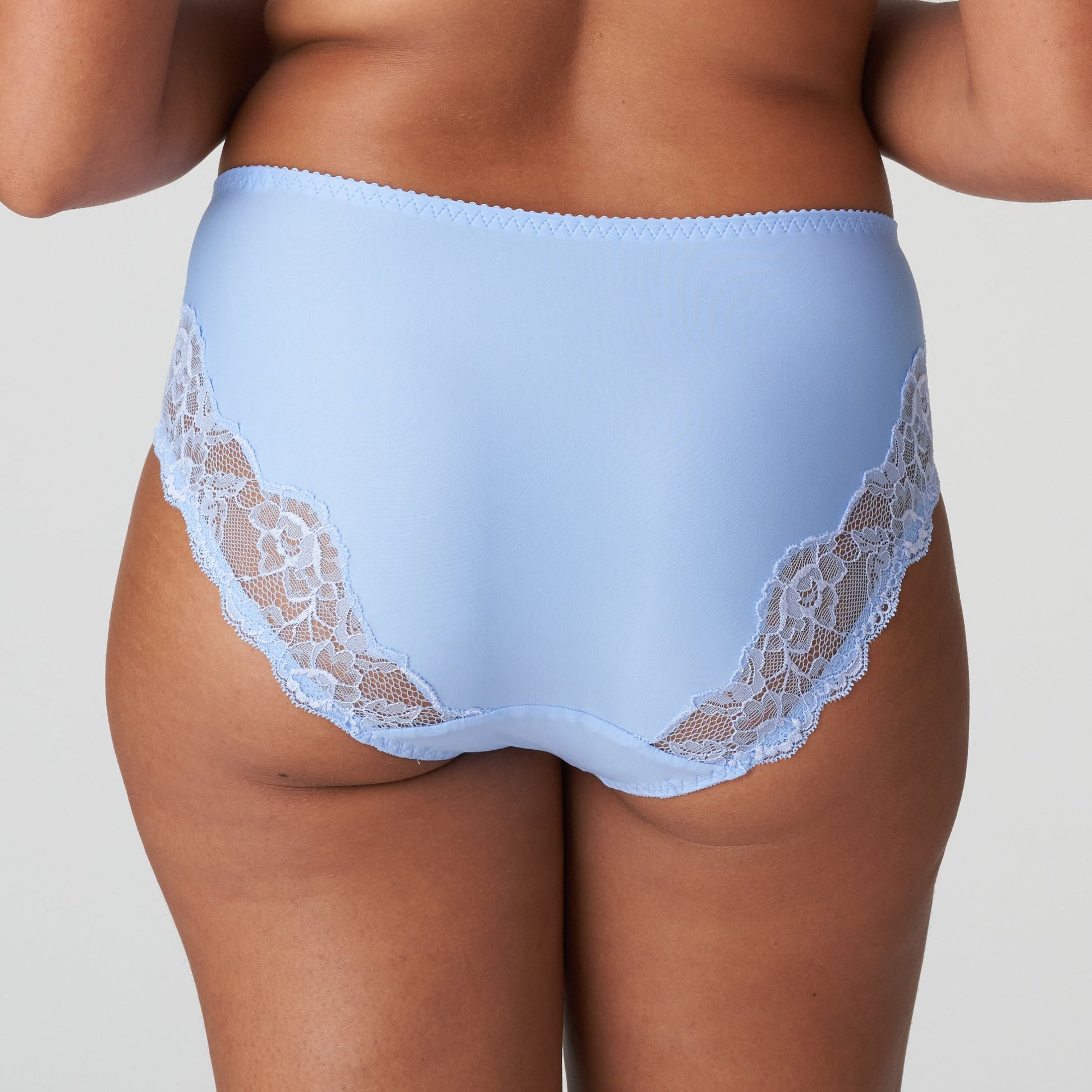 Back view of a woman wearing the Madison Full Brief panty in Periwinkle Floral by PrimaDonna.