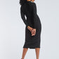 Back view of woman wearing a dolman sleeve batwing pullover in black bamboo paired with a stretch crepe ruched pencil skirt by Miriam Baker.