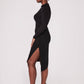Side view of a woman wearing a high waisted black asymmetrical pencil skirt with cut out by Miriam Baker.