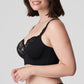 Side view of a woman wearing the Madison Longline Bra with plunging neckline in Black by PrimaDonna.