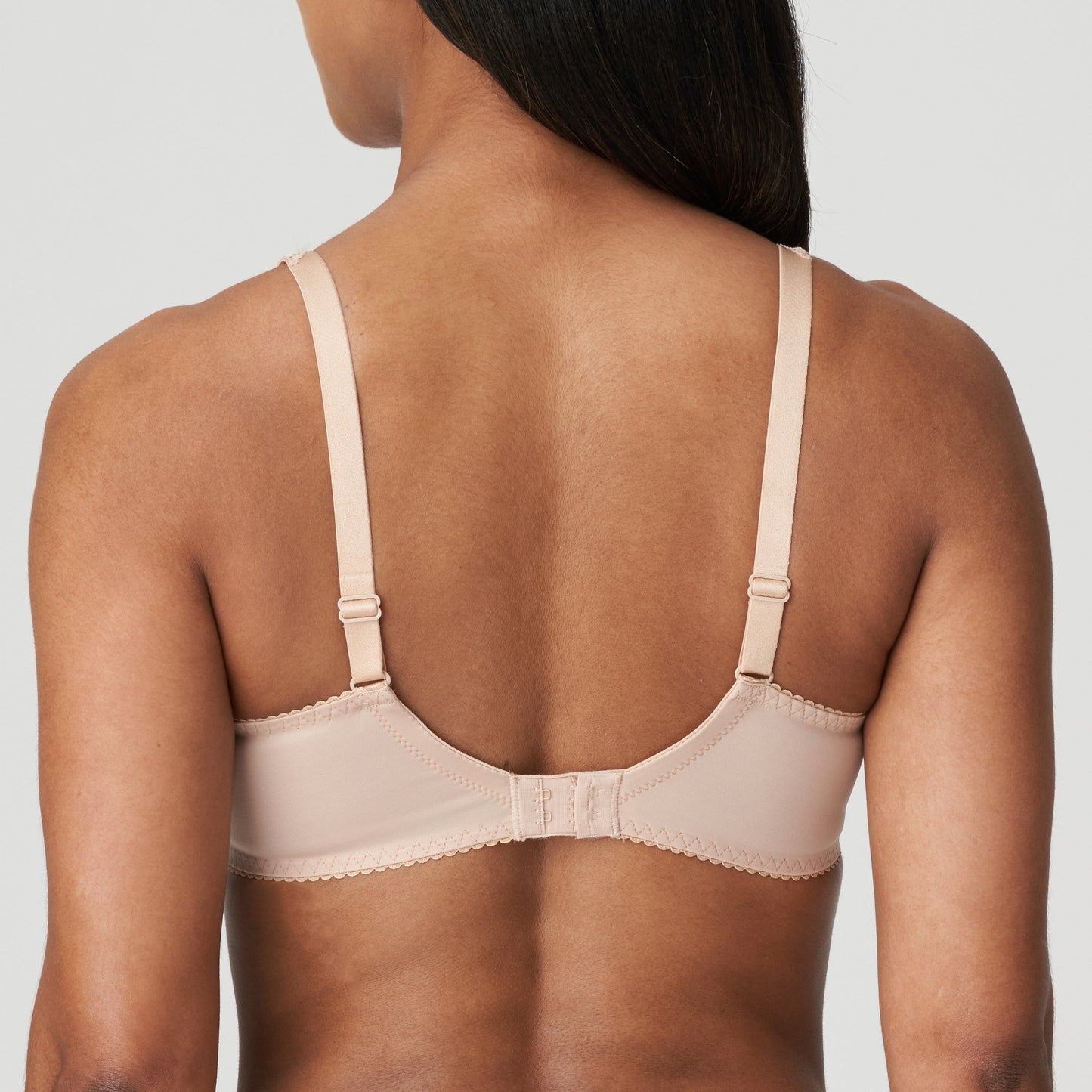 Back view of a woman wearing the Madison Unpadded Seamless T-Shirt Bra in Caffe Latte by PrimaDonna.