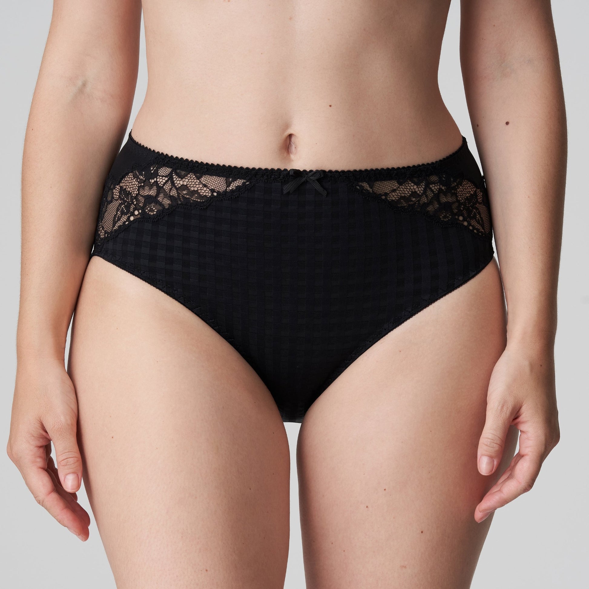 Front view of a woman wearing the Madison Full Brief panty with lace in Black by PrimaDonna.