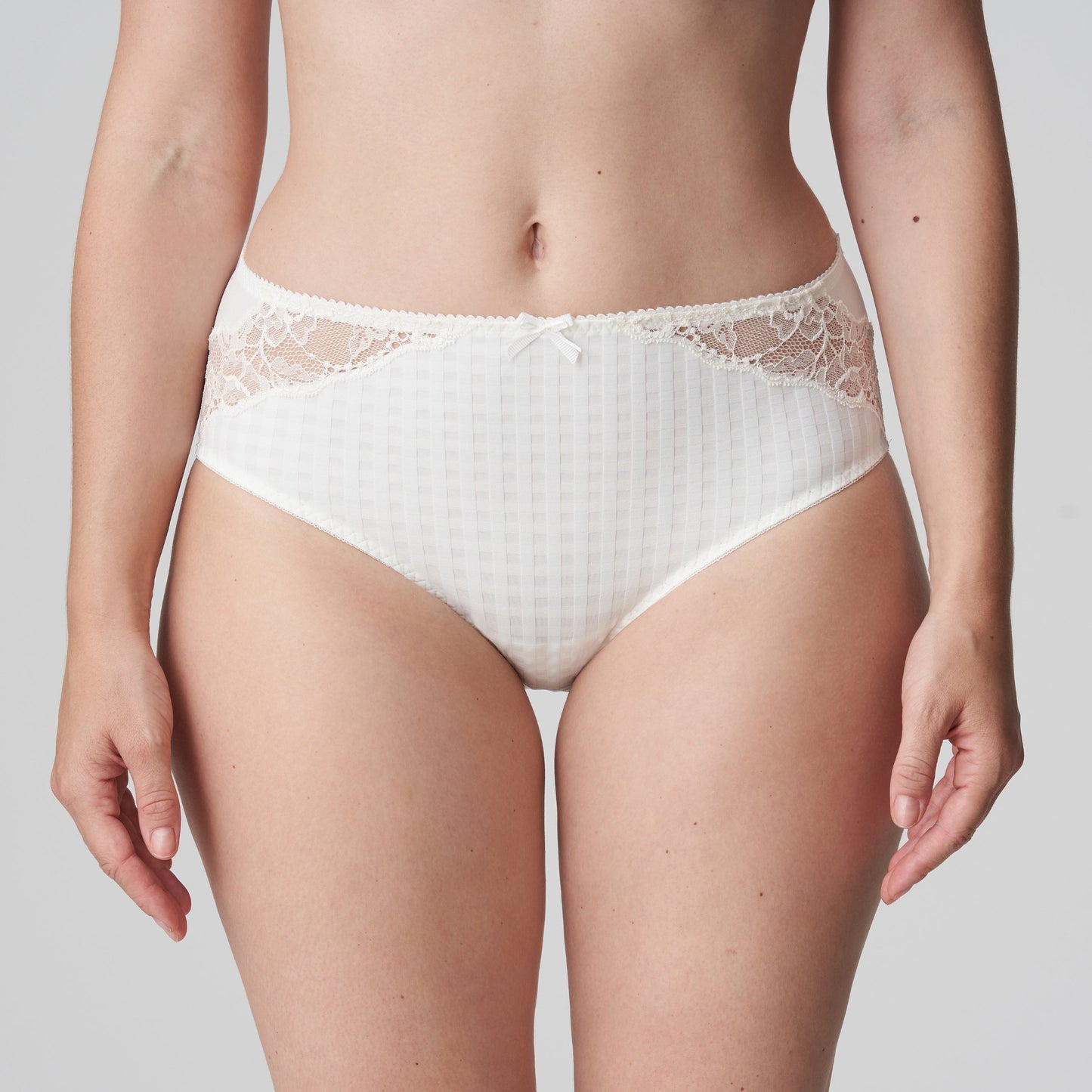 Front view of a woman wearing the Madison Full Brief panty with lace in Natural by PrimaDonna.