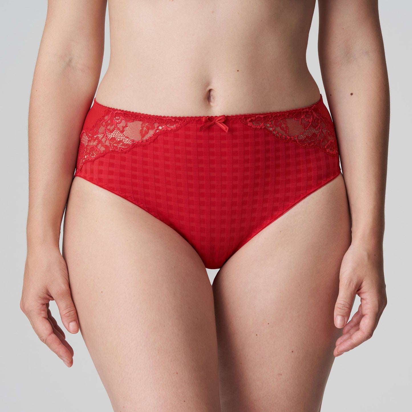 Front view of a woman wearing the Madison Full Brief panty with lace in Scarlet by PrimaDonna.