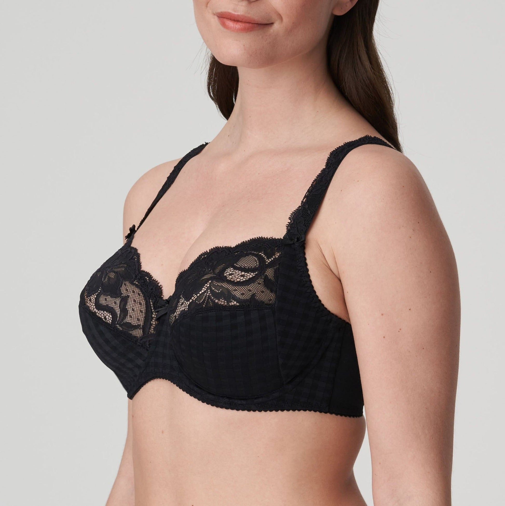 Side view of a woman wearing the DD+ Madison full cup bra in black by PrimaDonna.