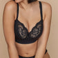 A woman wearing the DD+ Madison Longline Bra with plunging neckline in Black paired with the matching thong by PrimaDonna.