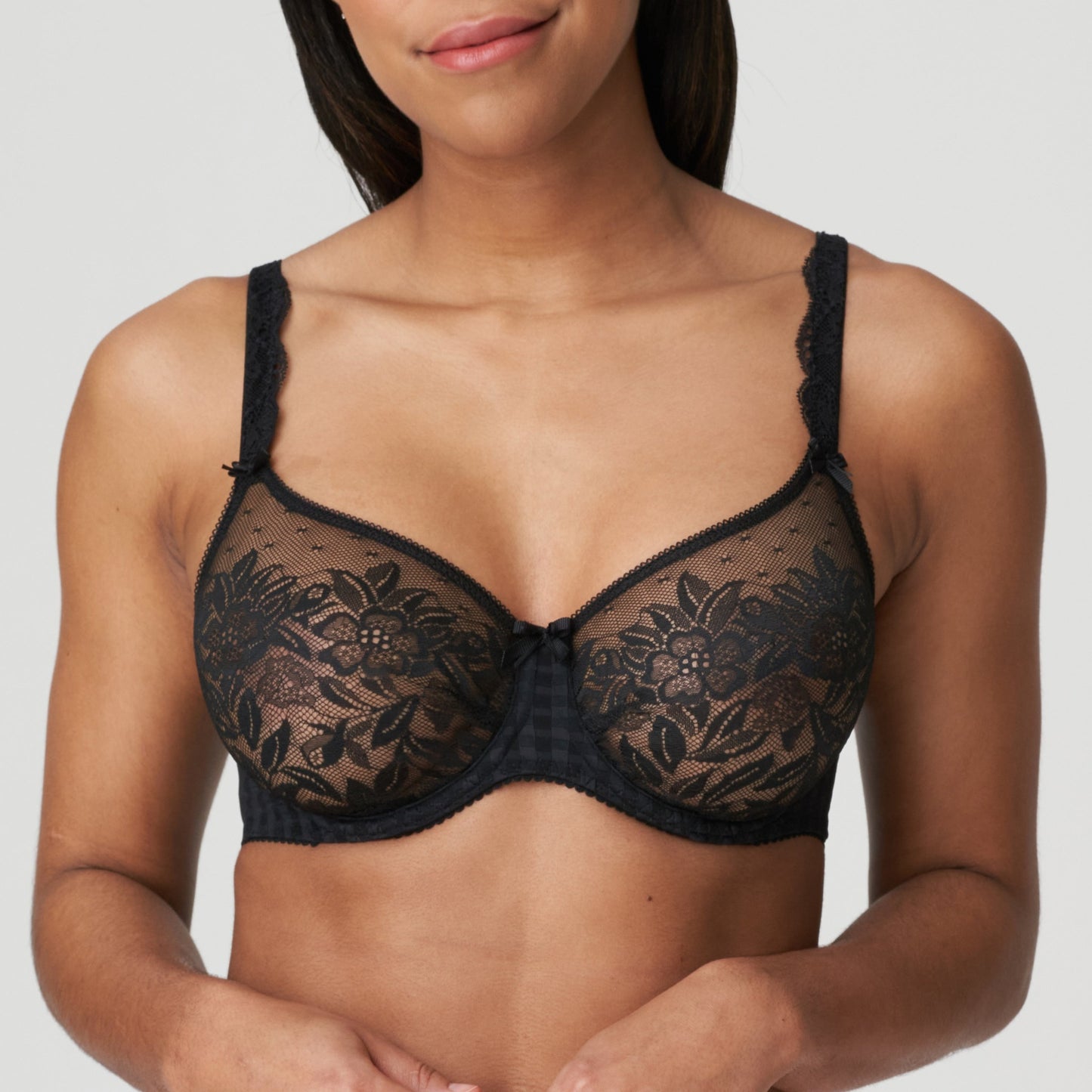 Front view of a woman wearing the DD+ Madison Unpadded Seamless T-Shirt Bra in Black by PrimaDonna.