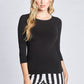 Front view of a woman wearing a black 3/4 length sleeve fuller bust viscose pullover with a jewel neckline by Miriam Baker.