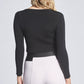 Back view of a woman wearing a black fuller bust long sleeve scoop neck pullover designed by Miriam Baker.