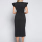 Back view of a woman wearing a black stretch viscose fuller bust boatneck midi dress with front slit, waist sash, and flutter sleeves designed by Miriam Baker.