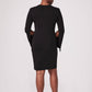 Back view of a woman wearing a black stretch viscose fuller bust princess line split sleeve bodycon dress with a crew neck and invisible zipper designed by Miriam Baker.