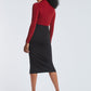 Back view of a woman wearing a red stretch viscose fuller bust long sleeve mock neck pullover by Miriam Baker.