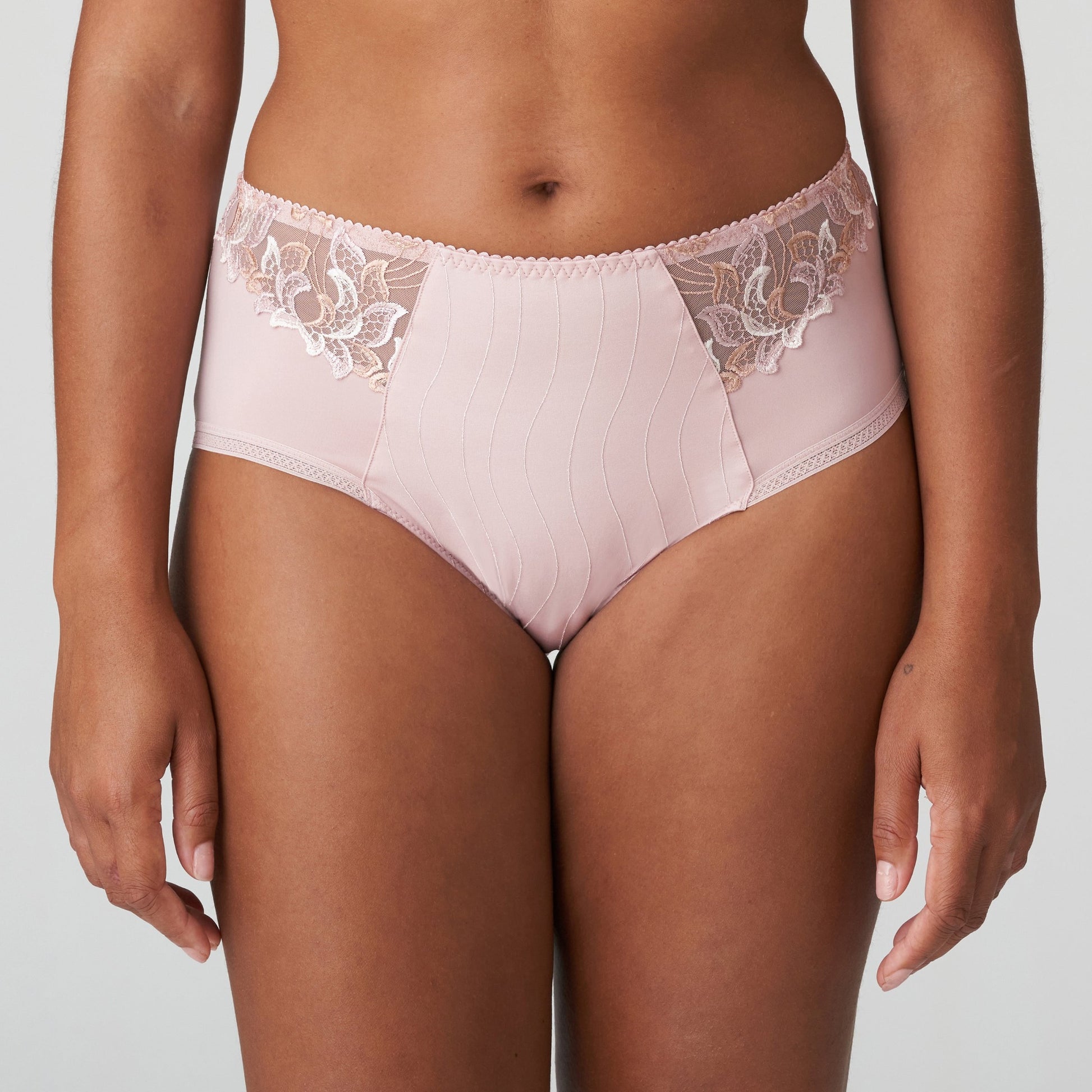 Woman wearing the Deauville high-waisted full brief with luxurious lace in Vintage Pink by Primadonna.