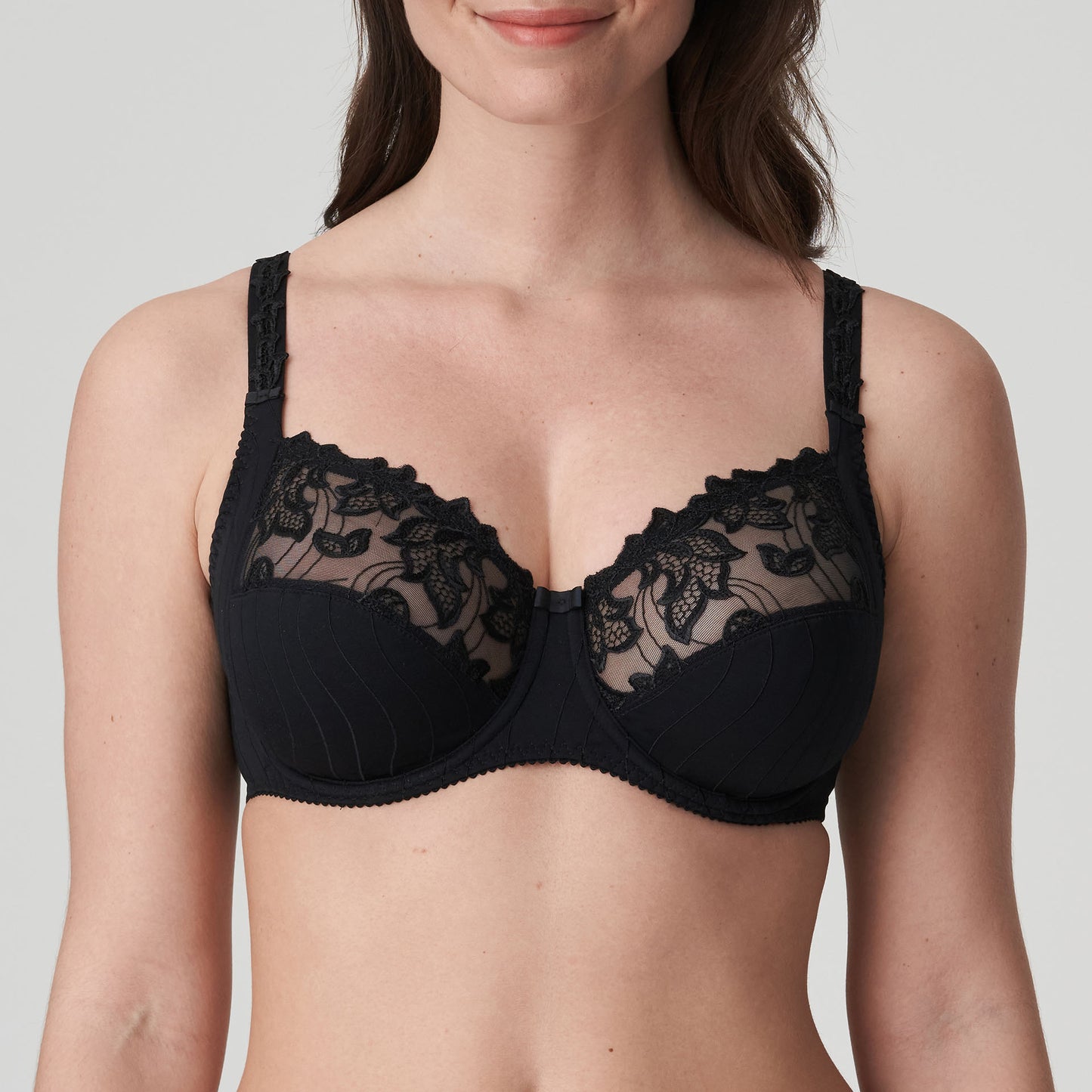 Woman wearing a supportive full cup underwire bra for large breasts in black by PrimaDanna.
