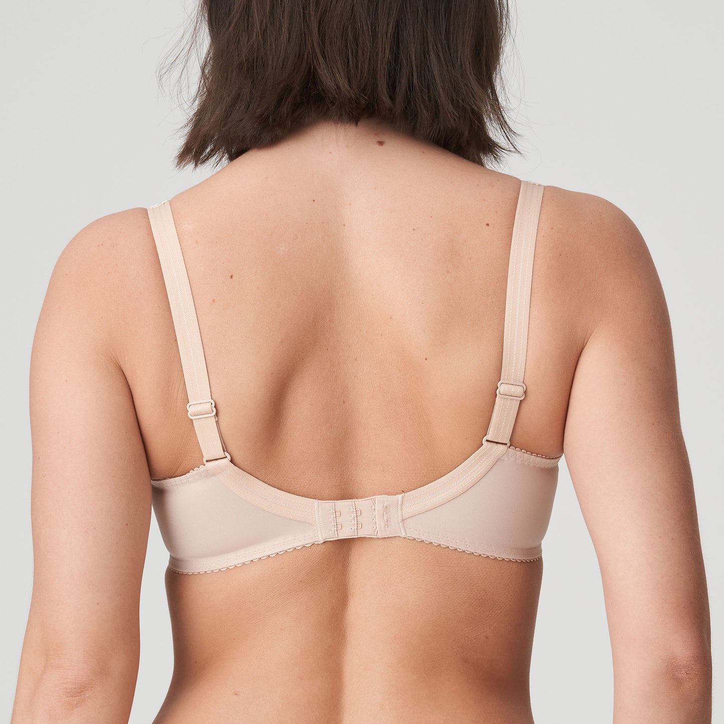 Back view of a woman wearing a supportive full cup underwire bra for large breasts in caffe latte by PrimaDanna.