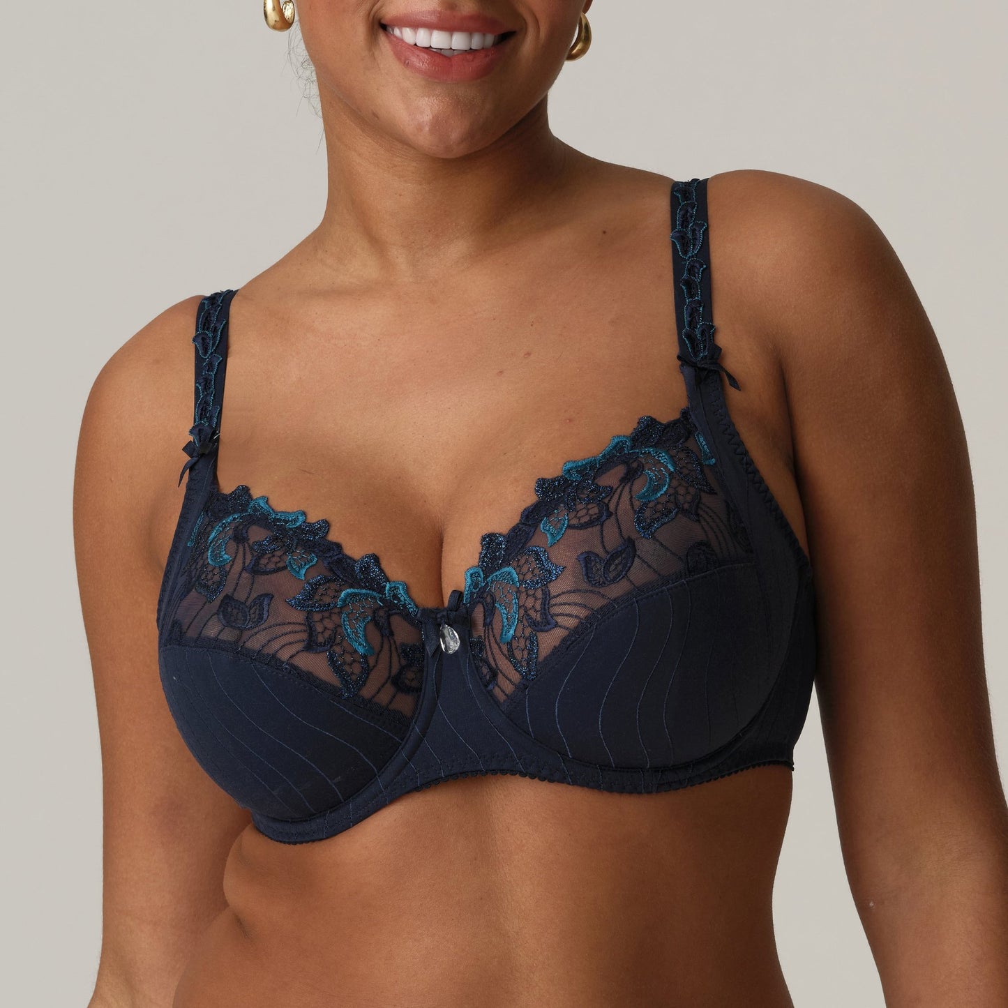 Front view of a woman wearing a supportive full cup underwire bra for large breasts in velvet blue by PrimaDanna.