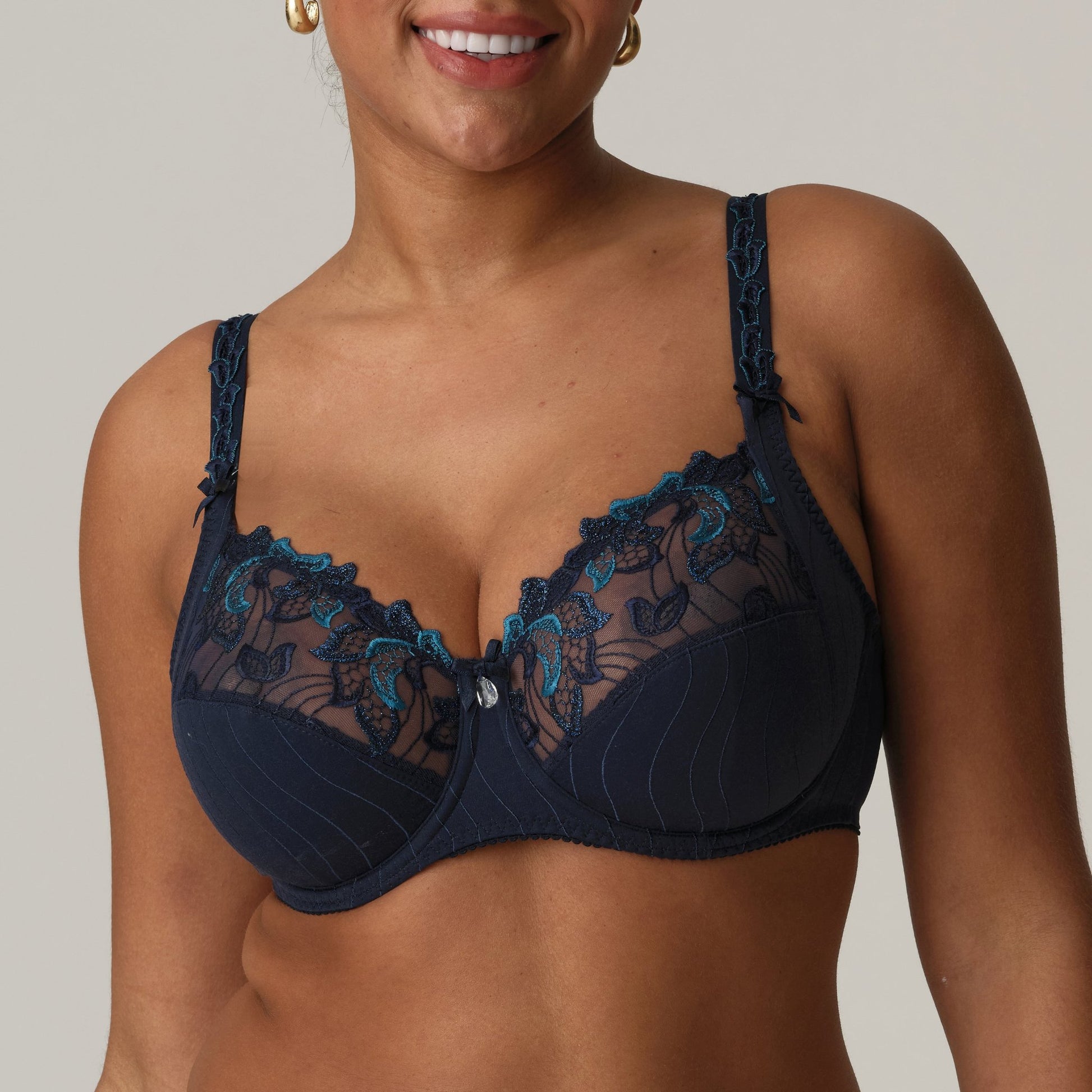 Front view of a woman wearing a supportive full cup underwire bra for large breasts in velvet blue by PrimaDanna.