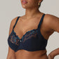 Side view of a woman wearing a supportive full cup underwire bra for large breasts in velvet blue by PrimaDanna.