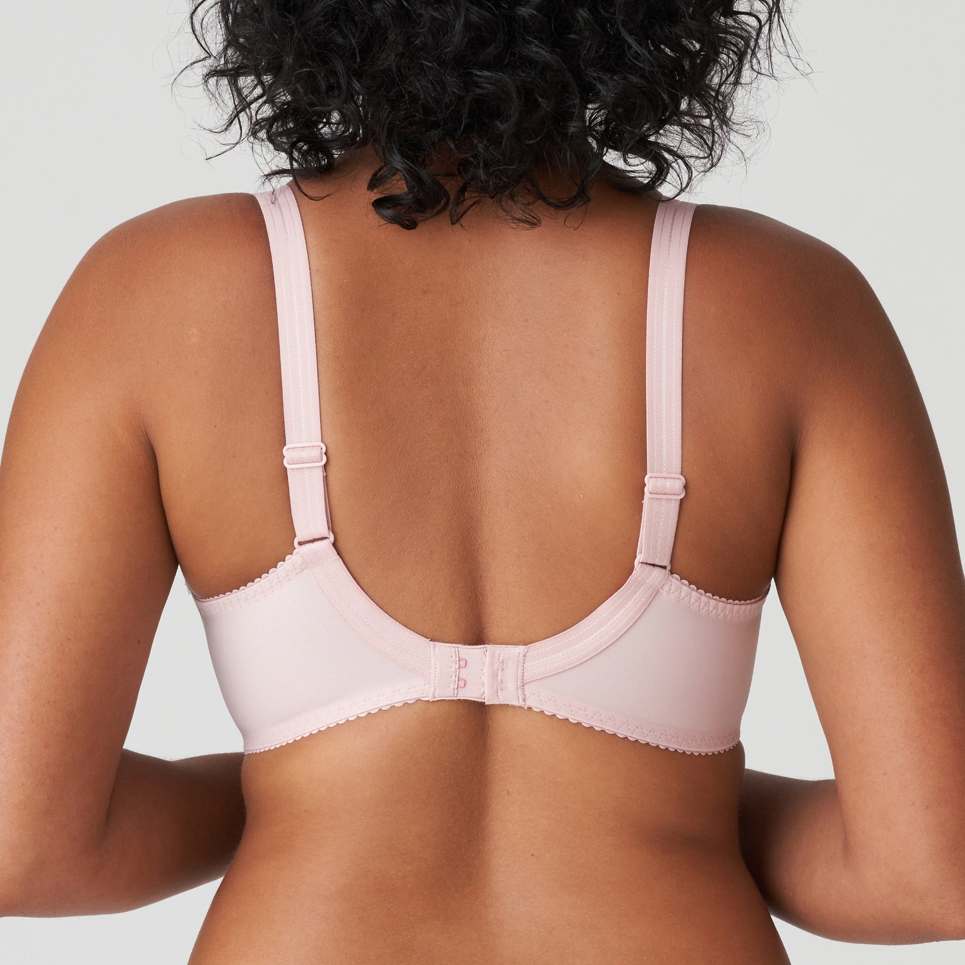 Back view of a woman wearing a supportive full cup underwire bra for large breasts in vintage pink by PrimaDanna.