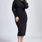 Woman wearing a black boatneck stretch raglan sleeve fuller bust midi length bodycon dress with back slit and invisible zipper by Miriam Baker.