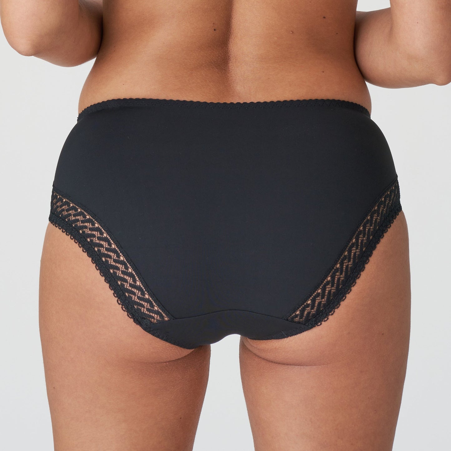 Back view of a woman wearing the Montara Full Brief panty in Black designed by PrimaDonna.