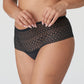 Side view of a woman wearing the Montara luxury thong with all over lace design in Black by PrimaDonna.