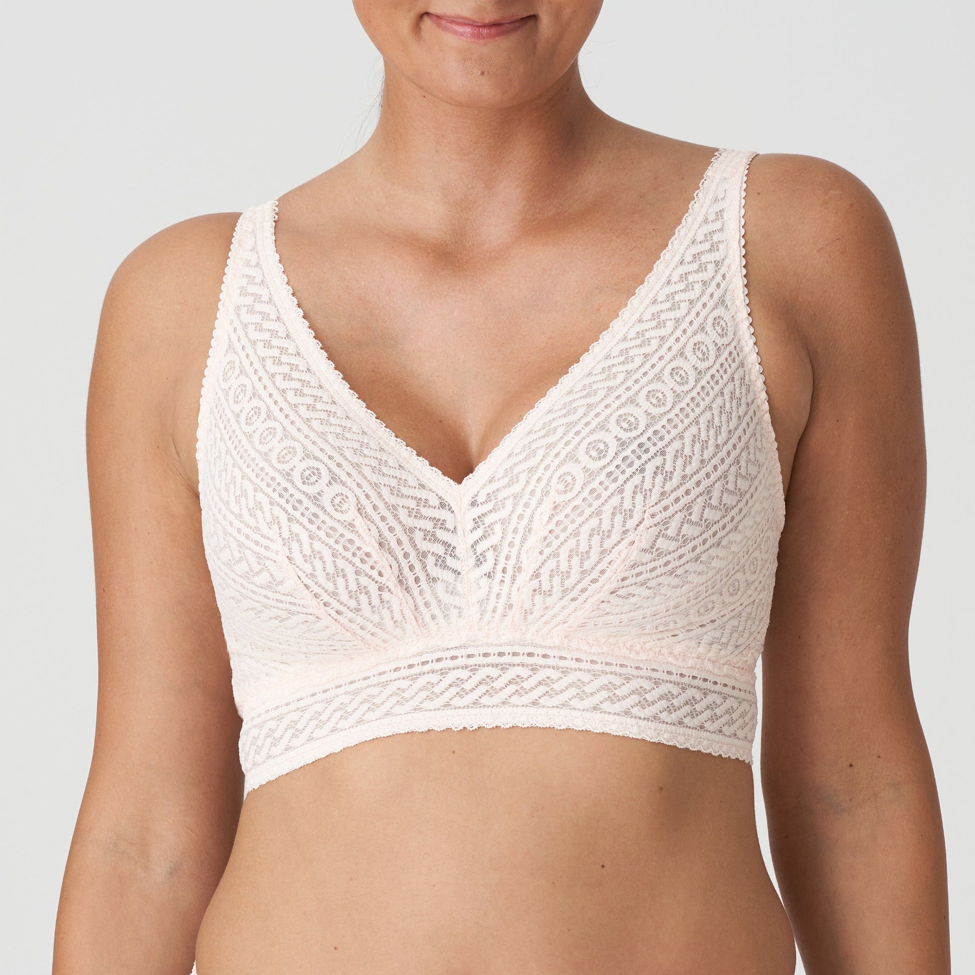 Front view of a woman wearing the Montara DD+ wireless longline full support bralette in Crystal Pink by PrimaDonna.