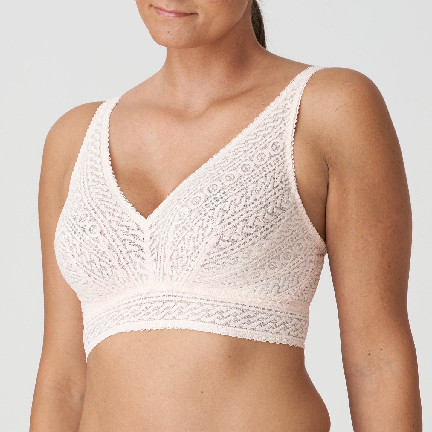 Side view of a woman wearing the Montara DD+ wireless longline full support bralette in Crystal Pink by PrimaDonna.