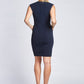 Back view of a woman wearing a Navy stretch viscose fuller bust sheath dress with pockets and cap sleeves designed by Miriam Baker.