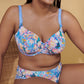 A woman wearing the DD+ Madison Moulded Cup Bra with light padding in Periwinkle Floral by Primadonna.