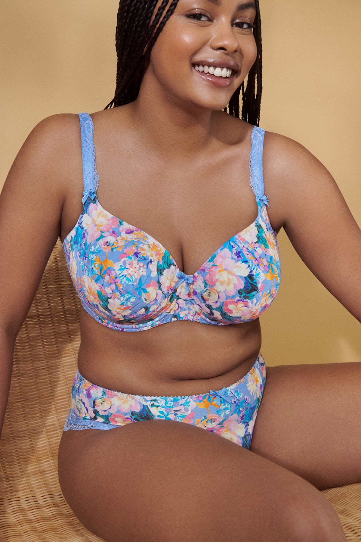 A woman wearing the DD+ Madison Moulded Cup Bra with light padding in Periwinkle Floral by Primadonna.