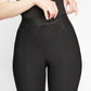 Front close up detailed view of a woman wearing a black stretch viscose cropped pant with elastic waistband designed by Miriam Baker.