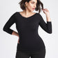 Woman wearing a black 3/4 length sleeve fuller bust bamboo pullover with stylized boatneck by Miriam Baker.