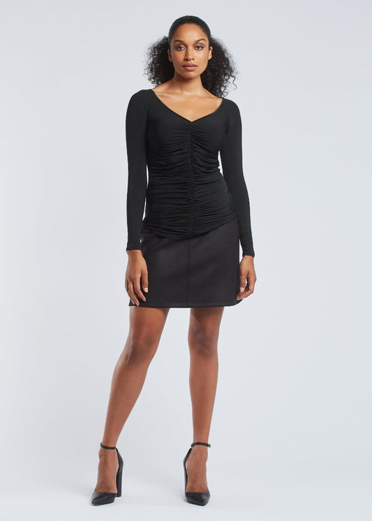 Woman wearing a black stretch viscose jersey v-neck long sleeve fuller bust pullover with front ruching designed by Miriam Baker.