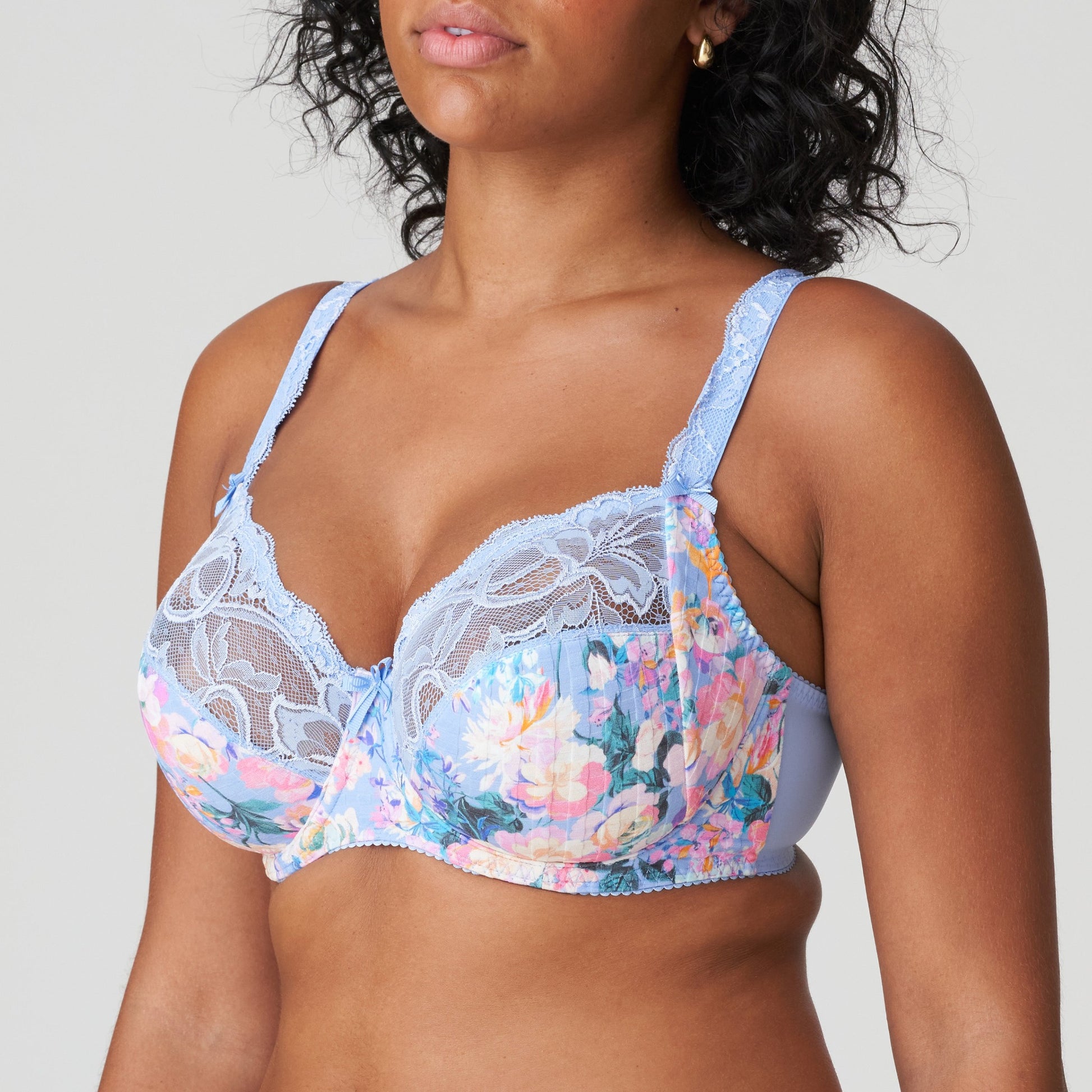 Side view of a woman wearing the DD+ Madison Full Cup Bra in Periwinkle Floral by PrimaDonna.