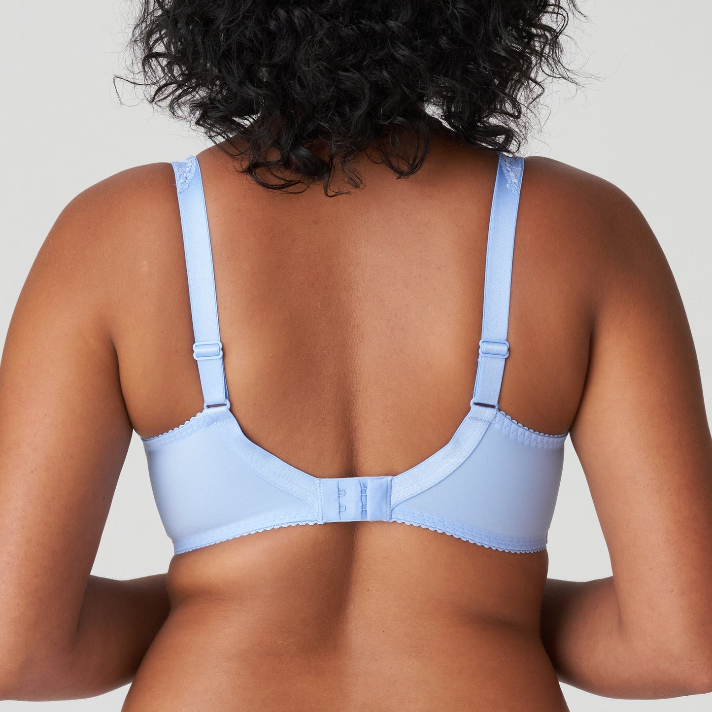 Back view of a woman wearing the DD+ Madison Full Cup Bra in Periwinkle Floral by PrimaDonna.
