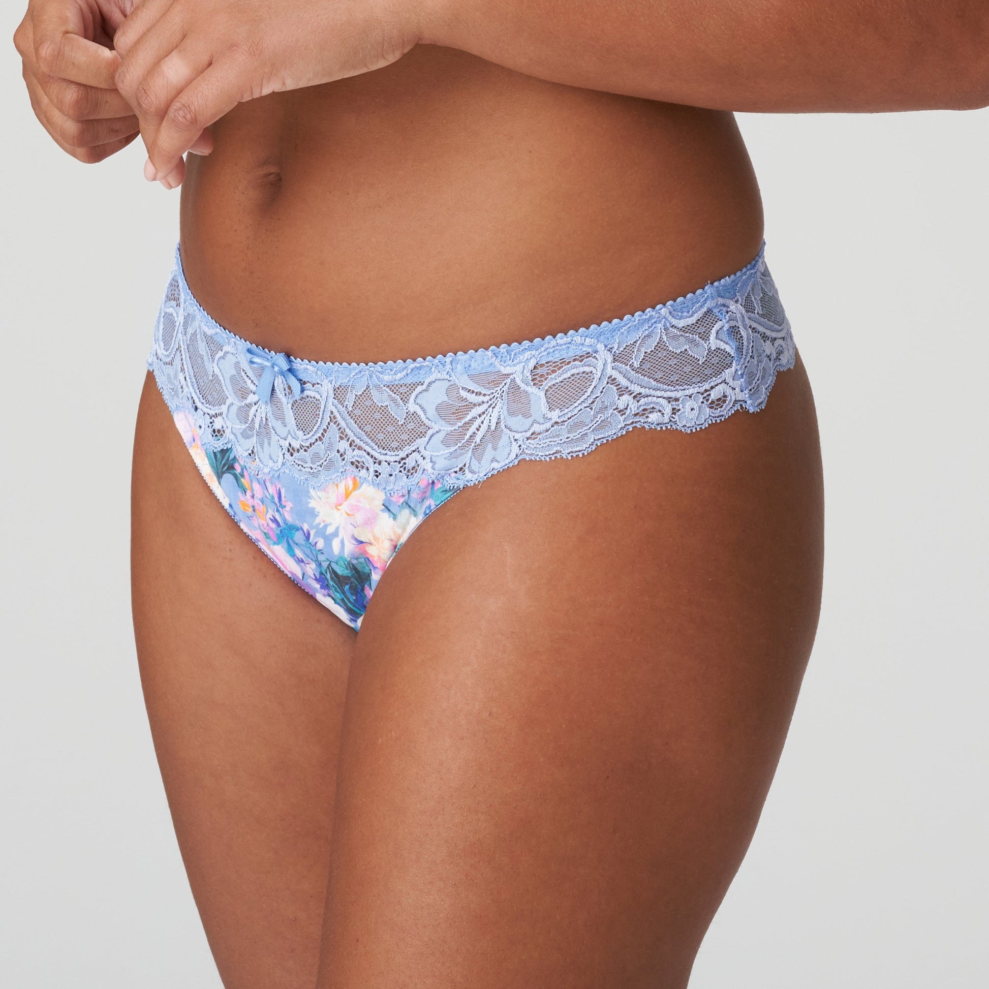Side view of a woman wearing the Madison Thong in Periwinkle Floral by PrimaDonna.