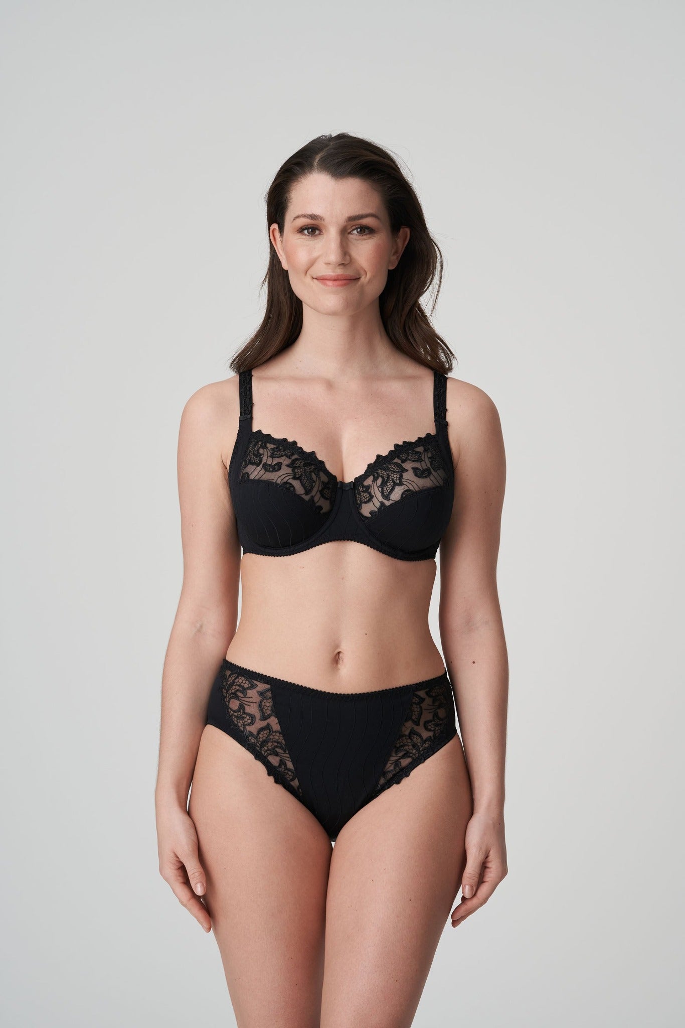 Front view of a woman wearing the Deauville full cup bra paired with the Deauville high-waisted full brief  in Black by Primadonna.