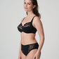 Side view of a woman wearing the Deauville full cup bra paired with the Deauville high-waisted full brief in Black by Primadonna.