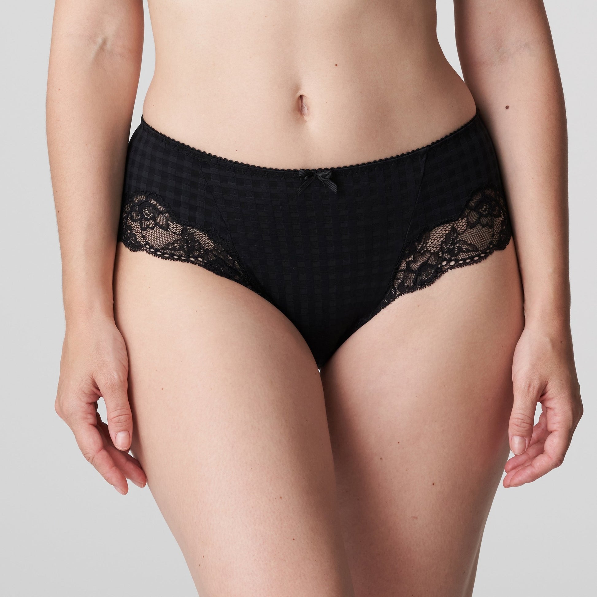Front view of a woman wearing the Madison cheeky cut panty with lace inserts in Black by Primadonna.
