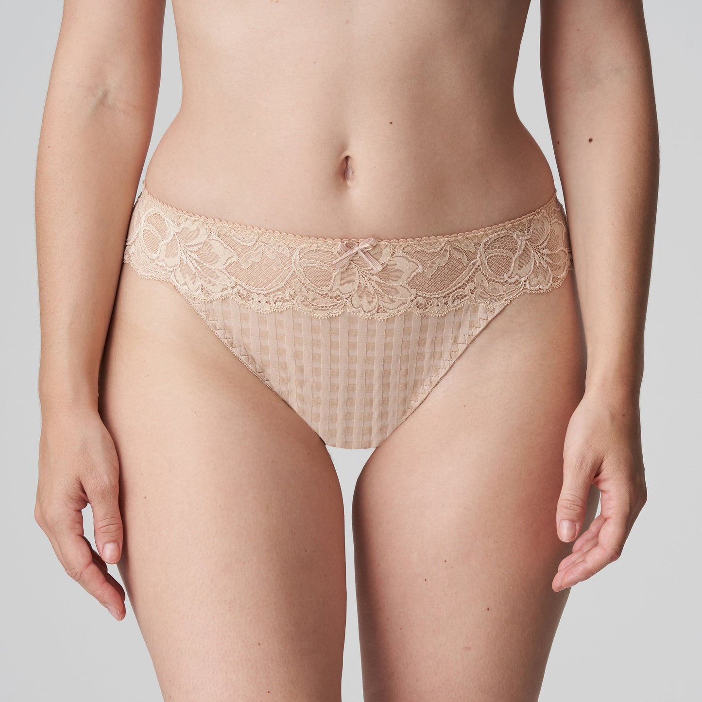 Front view of a woman wearing the Madison Thong in Caffe Latte by PrimaDonna.