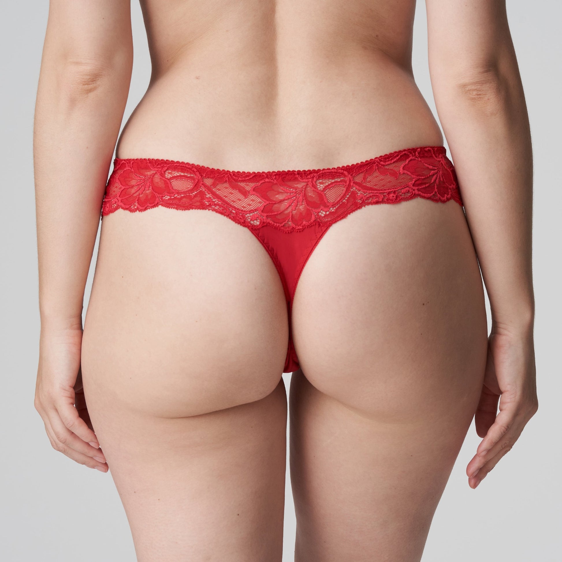 Back view of a woman wearing the Madison Thong in Scarlet by PrimaDonna.