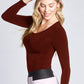Side view of a woman wearing a fuller bust long sleeve scoop neck pullover in Crimson designed by Miriam Baker.